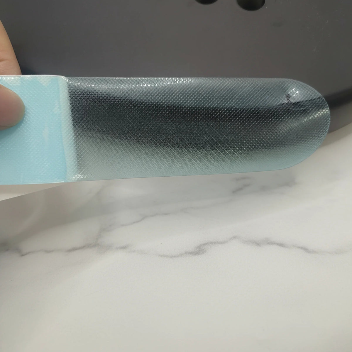A strip shaped for the top of the head